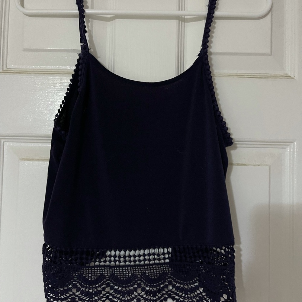 Navy blue tank top with lace trim on bottom